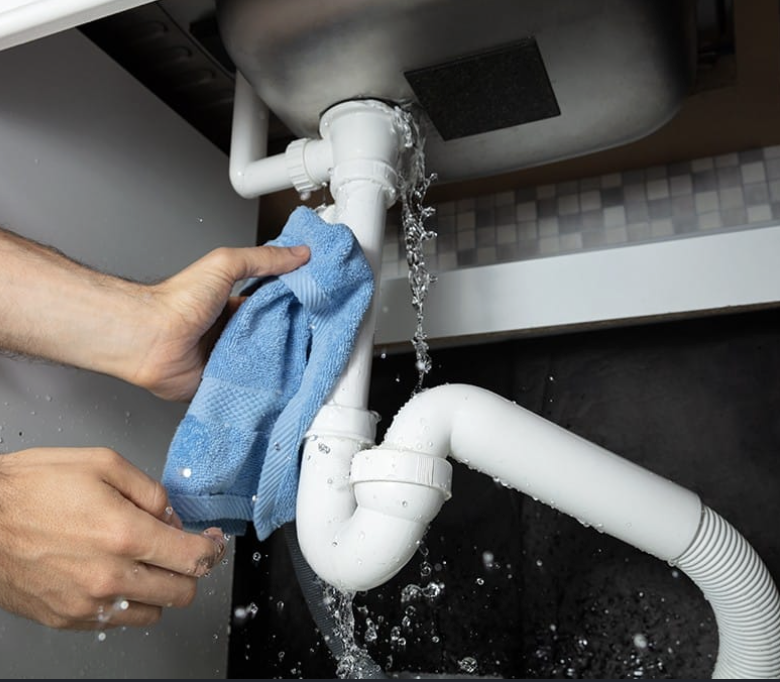 Plumber responding to an emergency pipe leak
